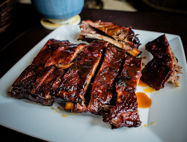 Delicious BBQ Ribs - Perfect for Your Next Event! Experience mouth-watering BBQ ribs prepared by our expert chefs. Indulge in tender, fall-off-the-bone meat, glazed with a tantalizing barbecue sauce. Ideal for BBQ catering, our ribs will impress your guests and make your event unforgettable."