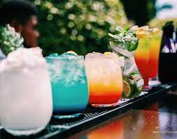 Raise the bar with mobile bar hire! Indulge in a tempting array of colorful cocktails, expertly crafted and ready to elevate your event